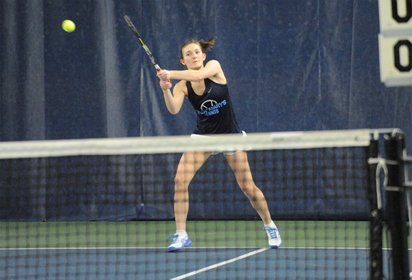 Megan Davy hits a back-hand tennis shot.